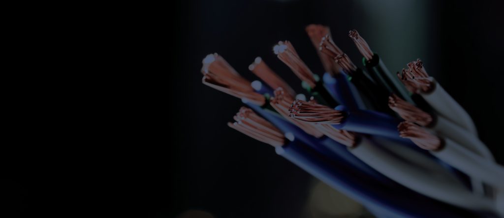 Darkened photo of wires with the insulation stripped on the ends.